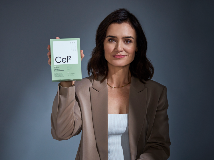 Woman holding SRW Cellular Energy product